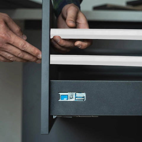 Person installing Premium Nine Inch Plastic Drawer Slides, Four Pack Side Mounted Guide Rails With Screws on a drawer.