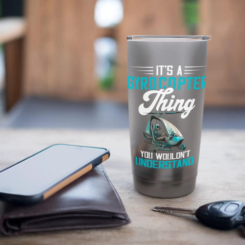 It's A Gyrocopter Thing You Wouldn't Understand Graphic Insulated Stainless Steel Tumbler For Pilots And Aviation Fans Gyroplane Autogyro Gyrocopter Gift on table with phone and keys