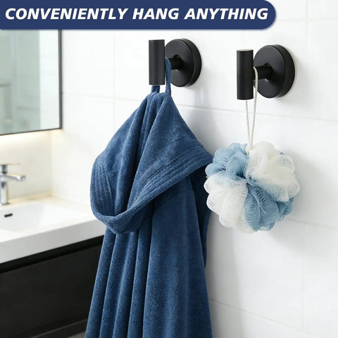 No Sweat Heavy Duty Suction Cup Shower Hooks In Matte Black holding a blue bathrobe and a loofah in a modern bathroom setup.
