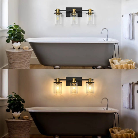 Three Light Black And Gold Bathroom Vanity Light Fixtures Over Mirror With Clear Glass Shade above a bathtub