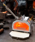 Ceramic fiber insulation blanket, 24x16x1 in, fireproof and heat resistant to 2700°F, installed in a small forge.