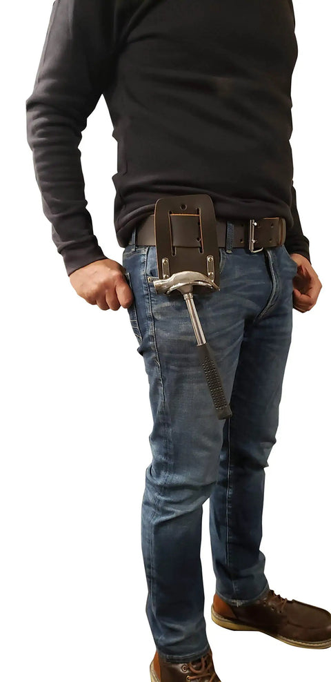 Person wearing a Premium Leather Hammer Holder And Tool Loop Holster For Three Inch Belts Heavy Duty Steel Cradle Keeps Your Hammer Secure.