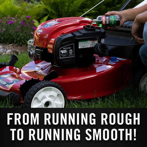 Kickstart Your Rig Small Engine Fuel Treatment And Carb Cleaner poured into a red lawn mower for smooth operation.