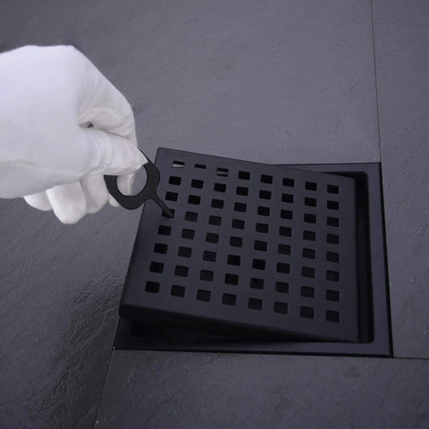 Removing grid cover from 6 Inch Stainless Steel Shower Floor Drain With Threaded Adapter And Removable Grid Cover With Slick Matte Black Finish For Bathroom Tiles And Fixtures Heavy Duty 304 Stainless Steel Drain.