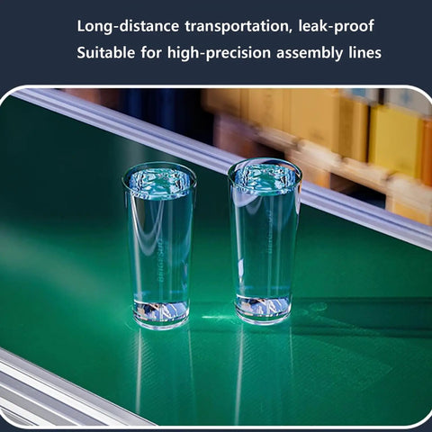 Compact LED Conveyor Belt For Factory Cargo 170X300mm with two glasses of water on a green surface for food processing.