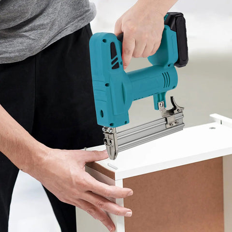 Man using Top Shelf 20V Cordless Brad Nailer Kit With 15Ah Battery Charger on furniture for carpentry task.