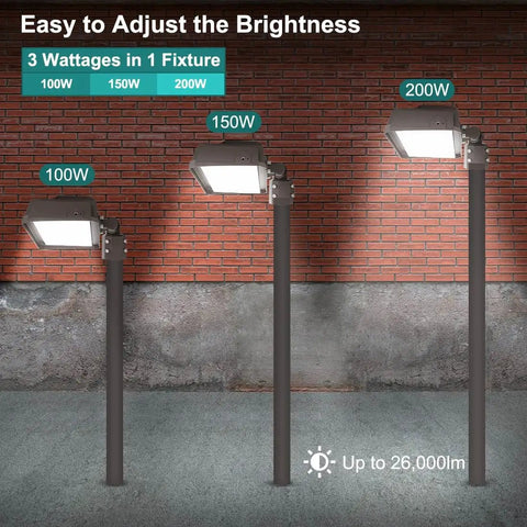 Three LED flood lights in 100W, 150W, 200W against brick wall, Beefy 200W LED Flood Light With Dusk to Dawn Photocell 26000 Lumens 5000K