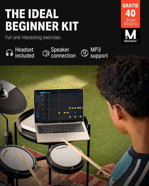 Person practicing on DED-80 Electronic Drum Set With 4 Quiet Mesh Pads, 180 Plus Sounds, visible laptop for lessons.