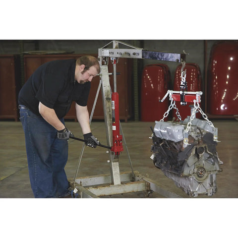 Heavy Duty 8 Ton Long Ram Hydraulic Floor Jack With Rapid Double Piston Pump For Smooth Car Raising helping to lift an engine.