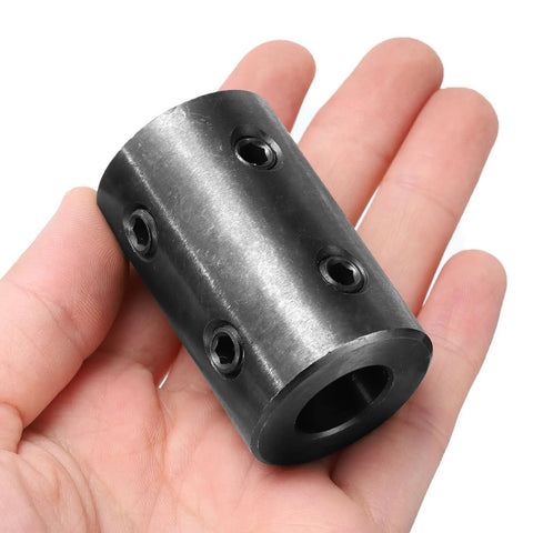 Beefy Rigid Shaft Coupling Set 5/8 Inch Bore To 1-1/4 Inch OD 2 Inch Long Black Oxide Steel With 4 Set Screws Motor Wheel Coupler held in hand