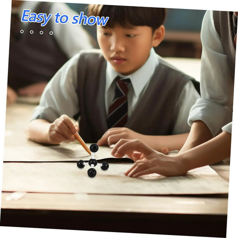 Student assembling Hands On Molecular Model Kit For Chemistry Education Classroom Science Teaching Tool with teacher guidance