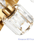 Close-up of Brass Gold 3 Light Vanity Light With Crystal Accents showing detailed crystal lampshade and brass base.