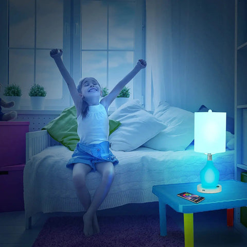 Girl in bedroom with Emergency Battery Back Up Table Lamp With USB Charging And Color Changing Base on nightstand