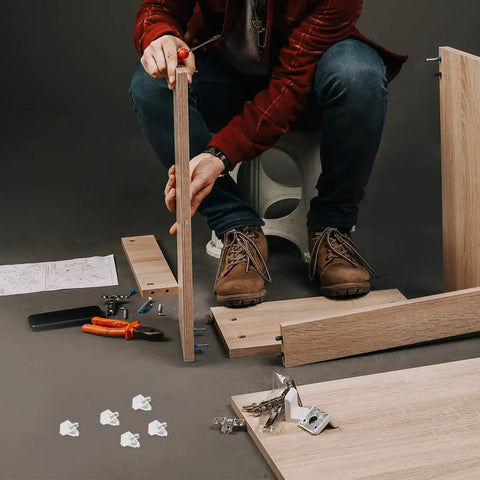 Assembling furniture using Clear Plastic Shelf Support Pegs Set Of 100 Self Locking Pins For Cabinet Shelves No Fuss Install