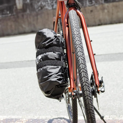 Bike with front fork cargo cage mount bottle holder for large bikepacking bag, black secure frame storage cage for extra luggage.