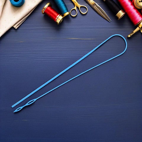 5 Piece Flexible Plastic Drawstring Threader Tool Set For Jeans Sweatpants Hoodies And Jackets Must Have DIY Sewing Accessory For Quick String Threading Wear Resistant With Universal Compatibility. Blue plastic drawstring threader on sewing table