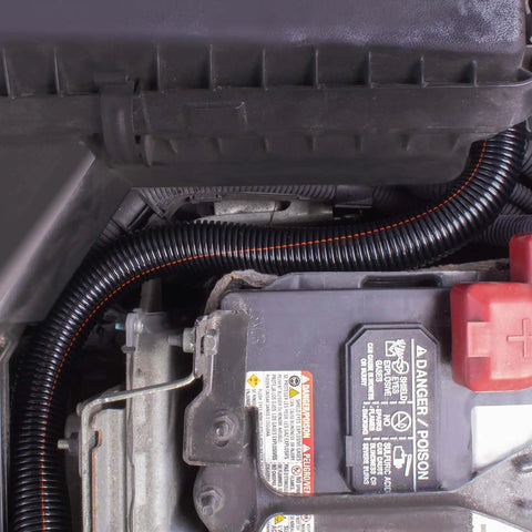Heavy Duty 9/16 Inch Non Slit Wire Loom Flexible Conduit Tubing 1000 Ft Roll protecting vehicle wiring under the hood.