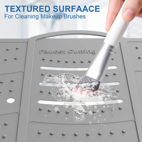 Real Deal Large Bathroom Sink Topper And Big Time Vanity Counter Mat Soft Silicone With Reinforced Steel Frame Heavy Load Bearing Waterproof Anti Slip Build For Low Maintenance Home Setup In Cool Grey, textured surface for cleaning makeup brushes.