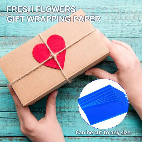 Hands holding gift with red heart and Blue Cellophane Flower Wraps Waterproof Wrapping Paper For Flowers inset on wood surface
