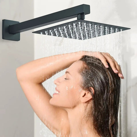 Top Tier Matte Black Rain Shower System With An Eight Inch Square Showerhead, woman enjoying a rainfall shower.