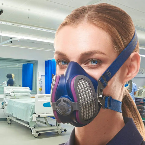 Person wearing Elipse P100 Elastomeric Half Mask With Source Control And Replaceable Reusable Filters Included Blue Comfort Fit For Work, Painting, And Dust Protection, Durable Respirator For Pro Jobs And DIY Projects in a medical setting