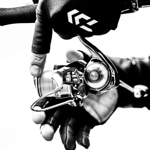 Angler handling Exist LT Spinning Reel with Lightweight MQ Body, ZAION Construction, Airdrive Rotor and Spool for smooth casting