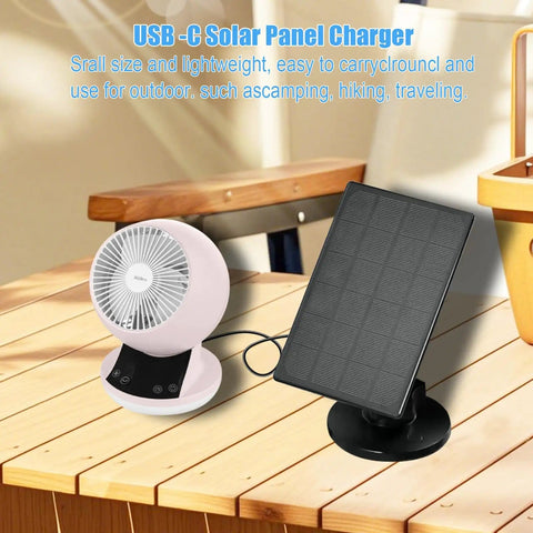 2W Solar Panel Charger For Rechargeable Battery Security Cameras With Micro USB And USB C Ports on wooden table