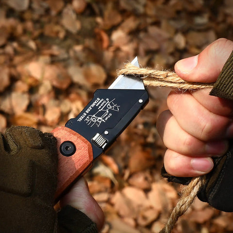 Kickass Folding Utility Knife With Solid Wood Handle And Tight Back Lock Heavy Duty Box Cutter cutting rope outdoors.