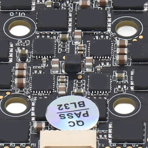 Close-up of BLHeli 32 4 In 1 ESC For FPV Drones showcasing circuitry and components, part of a 20x20 stack design.
