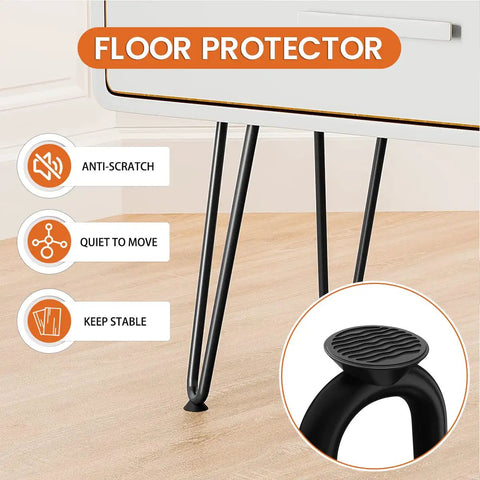 Close-up of black 16 inch hairpin table legs with rubber floor protectors on wooden floor.