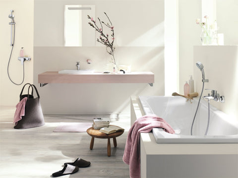 Modern bathroom with Cosmopolitan Centerset Bathroom Faucet With SilkMove Handle Starlight Finish EcoJoy, towel and decor.