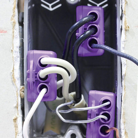AlumiConn Wire Connectors 2500 Pack Purple Electrical Aluminum Copper Wiring Repair Kit connecting multiple wires inside an outlet.