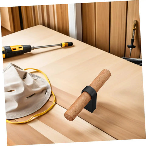 Solid Wood Cabinet Handle Black Drawer Pulls With Single Hole installed on light wood surface, next to tools.