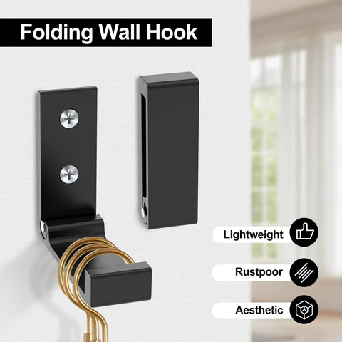 12 Piece Aluminum Alloy Folding Wall Hooks Heavy Duty Coat Hangers Foldable Rustproof Closet Organizer With Mounting Hardware For Coats Towels And Headphones showing a black wall hook mounted with a keyring.