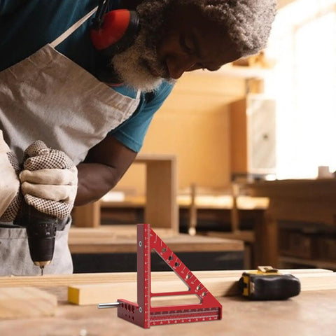 Pro Grade Aluminum Multi Angle Scribing Ruler For Woodworking with red markings on carpenter's workbench