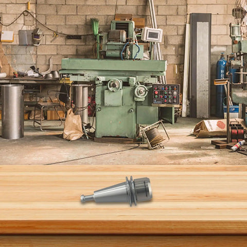 ISO25 ER20 Collet Chuck Tool Holder on wooden surface in workshop setting, designed for fast CNC engraving with tough alloy steel.