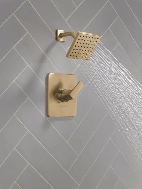 Rich Champagne Bronze Shower Head And Handle Set With Rock Solid Brushed Finish Valve Trim Kit showing full body spray.