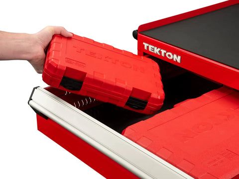 Hand placing red case for Three Eighth Inch Drive Six Point Impact Socket Set Thirty Seven Piece Kit With Shallow And Deep Sockets SAE And Metric into drawer.