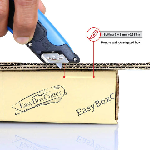 Heavy Duty Box Cutter With Three Adjustable Blade Depths And Precision Edge Guide cutting double wall corrugated box at setting two.