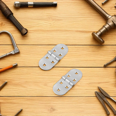 Bi Fold Stainless Steel Tray Hinges 4 Pack for Folding Tables and Desks on wooden surface with tools around