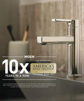Modern chrome kitchen faucet with award text for America's Most Trusted brand, displayed beside a kitchen sink and wooden background.