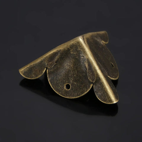 Solid Antique Bronze Corner Protectors - Detailed view of a single corner bracket made from solid plated iron.