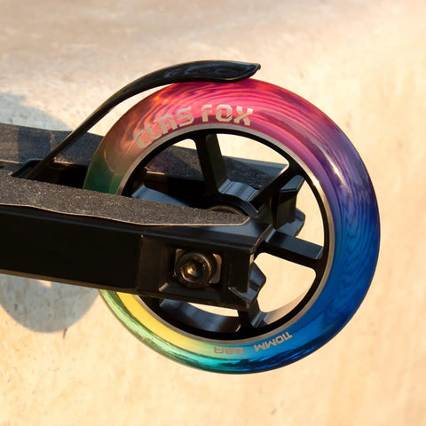 Top Shelf Pro Stunt Scooter Wheels 110Mm With Fast Rolling Abec 9 Bearings And Cnc Machined Aluminum Core Mid Rebound Polyurethane Shell Designed For Nailing Every Kick Flip Tricking Session Red Yellow Blue close-up of colorful wheel on scooter
