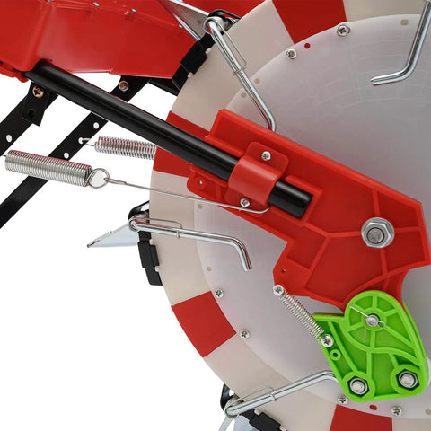Close-up of Manual Seeder With 7 Nozzles Handheld Seeding Machine showing red and green components and adjustable depth mechanism.