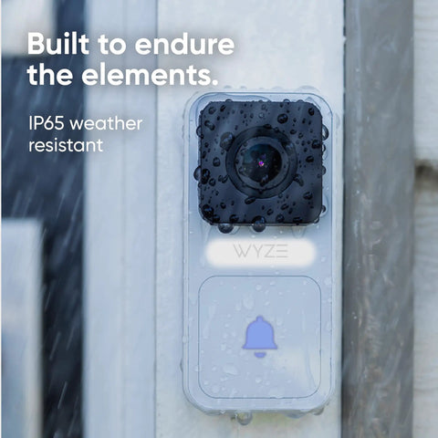 Close-up of weather-resistant video doorbell with visible raindrops on lens, built for outdoor use, highlighting IP65 rating.