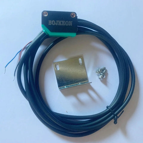 Compact diffuse photoelectric sensor with background suppression, sensing range 5 to 350 mm, shown with mounting bracket and screws.