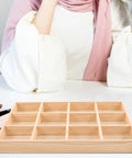 Straight Up Premium Solid Wood Jewelry Tray With 12 Divided Compartments displayed on a desk with makeup tools.