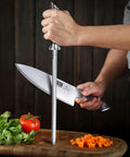 Person using 10 Inch Professional Kitchen Knife Sharpener Rod For All Chef Knives With Japanese High Carbon Steel Ergonomic Pakkawood Handle.