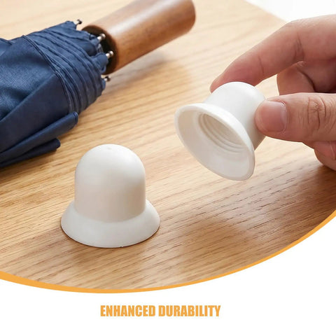 Upgrade Your Shade Game With Sturdy White Patio Umbrella Pole End Cap Replacement Kit Featuring Quick Tool-Free Install, Wind Resistance And Scratch Protection For Beach Tents And Garden Canopies. White plastic umbrella pole end cap shown in hand, one on table.
