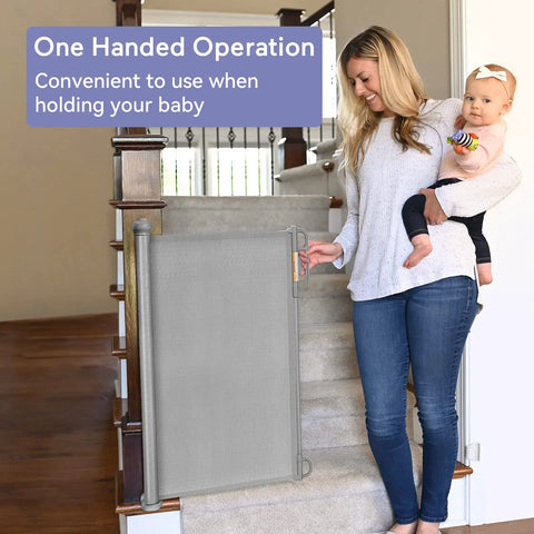 Woman holding a baby using retractable mesh baby gate for stairs and doorways, extra wide up to 71 inches, 33 inches tall, easy install
